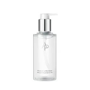 A white bottle with a pump dispenser, labeled 'AP BEAUTY Badroderma Cleansing Oil to Milk 150 ml'. The bottle has a minimalist design with the brand name and product name printed in black text.