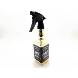 A gold-colored plastic water spray bottle with an adjustable nozzle. The label on the bottle says 'Barber Shop'.