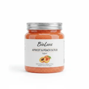 A 500ml bottle of BioLuxe Apricot & Peach Exfoliating Scrub. The bottle has a peach and white label with the BioLuxe logo.