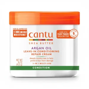 A white and green bottle of Cantu Creamy Hair Lotion with Shea Butter. The label displays the Cantu brand name and product name.