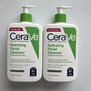 A white bottle with a blue label, containing CeraVe Hydrating Facial Cleanser. The label displays the product name and key ingredients.