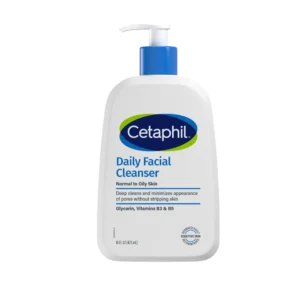 A white bottle of Cetaphil Daily Facial Cleanser with a blue label. The bottle has a pump dispenser on top.