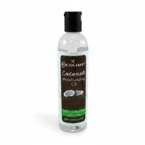 A clear glass bottle with a white label displaying the Cococare brand name and product name 'Coconut Moisturizing Oil'. The bottle contains a clear, golden-colored coconut oil liquid.