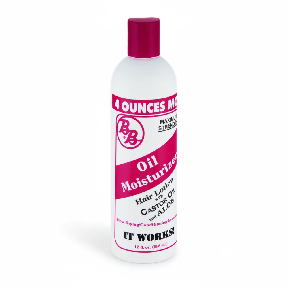 A bottle of Shea Moisture Castor Oil & Aloe Replenishing Hair Lotion with a green and white label. The bottle is filled with a light yellow-colored moisturizing lotion.