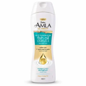 A green and white bottle of Dabur Amla Oil Therapy Anti-Breakage Shampoo with a label featuring the Dabur logo and product name