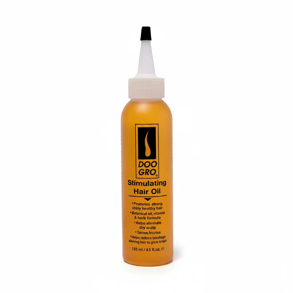 A brown glass bottle with a black cap, containing a clear golden-colored hair oil. The label has the Doogro brand name and 'Stimulating Hair Oil' text.
