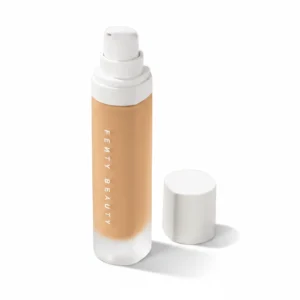 A glass bottle of Fenty Beauty Pro Filt'r Soft Matte Longwear Liquid Foundation in the shade 390. The bottle has a black cap and label with the Fenty Beauty logo.