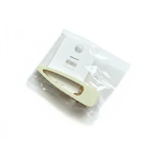 Assorted metal hair clips in various sizes and shapes, including round, oval, and rectangular designs in silver, gold, and black colors