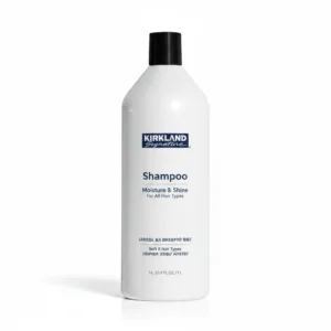 Two clear plastic bottles with white labels and caps, one labeled 'Kirkland Signature Moisturizing Shampoo' and the other 'Kirkland Signature Moisturizing Conditioner'
