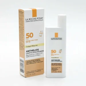 A bottle of La Roche-Posay Anthelios Mineral Tinted Ultra Light Face Sunscreen Fluid SPF 50 in a light blue color with white text on the label.