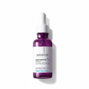 A clear glass bottle with a white label that says 'La Roche-Posay Niacinamide 10% Serum'. The bottle has a dropper top and the serum inside is a clear, light yellow liquid.