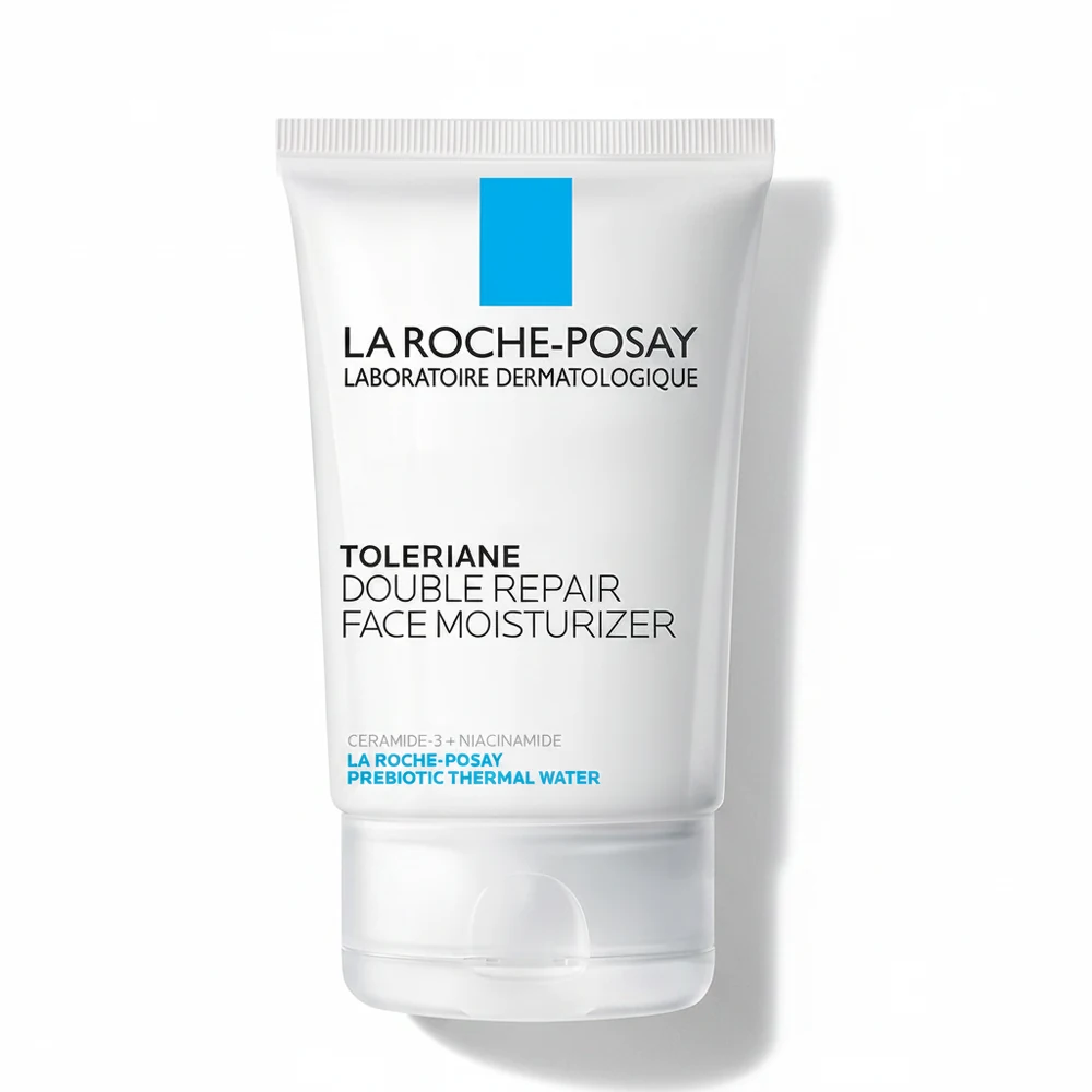 A white and blue bottle of La Roche-Posay Toleriane Double Repair Face Moisturizer with SPF 30. The label displays the brand name, product name, and key ingredients.