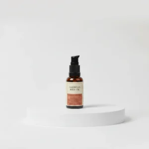A bottle of Gaayou Warm Vanilla Bean Body Oil with a light beige label. The bottle contains a clear, golden-colored oil.
