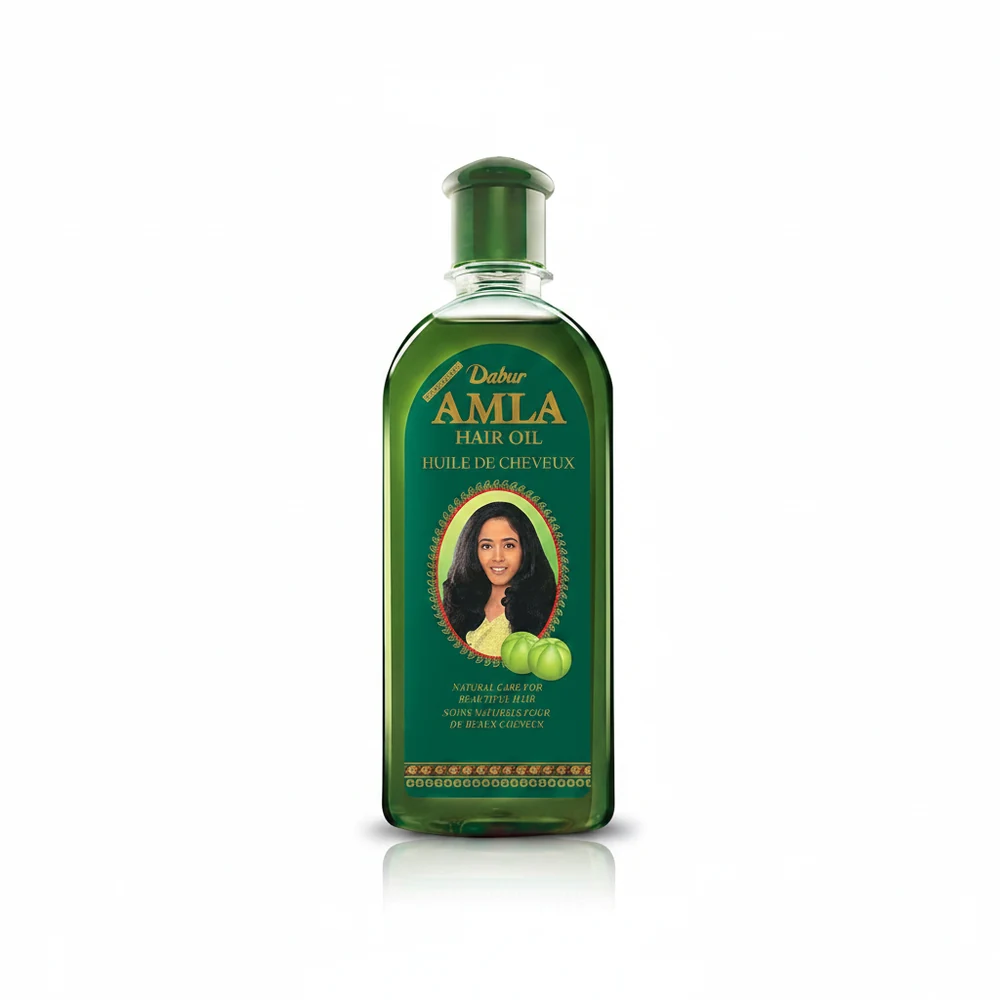 A bottle of Patanjali Amla Hair Oil with a green and white label. The bottle contains 100ml of the lightweight, non-greasy hair oil.