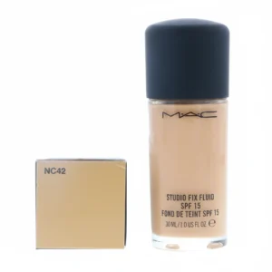 A glass bottle of MAC Studio Fix Foundation in the shade NC42, with a black cap. The label has the MAC logo and product name.