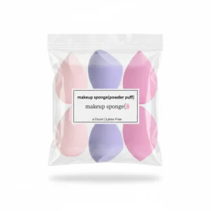 A round, beige makeup sponge with a pointed tip. The sponge has a soft, absorbent texture and is shown against a plain background.