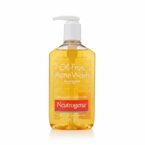 A white bottle with the Neutrogena logo and the product name 'Oil Free Acne Wash' printed on the label. The bottle contains 269ml of the acne-fighting cleanser.