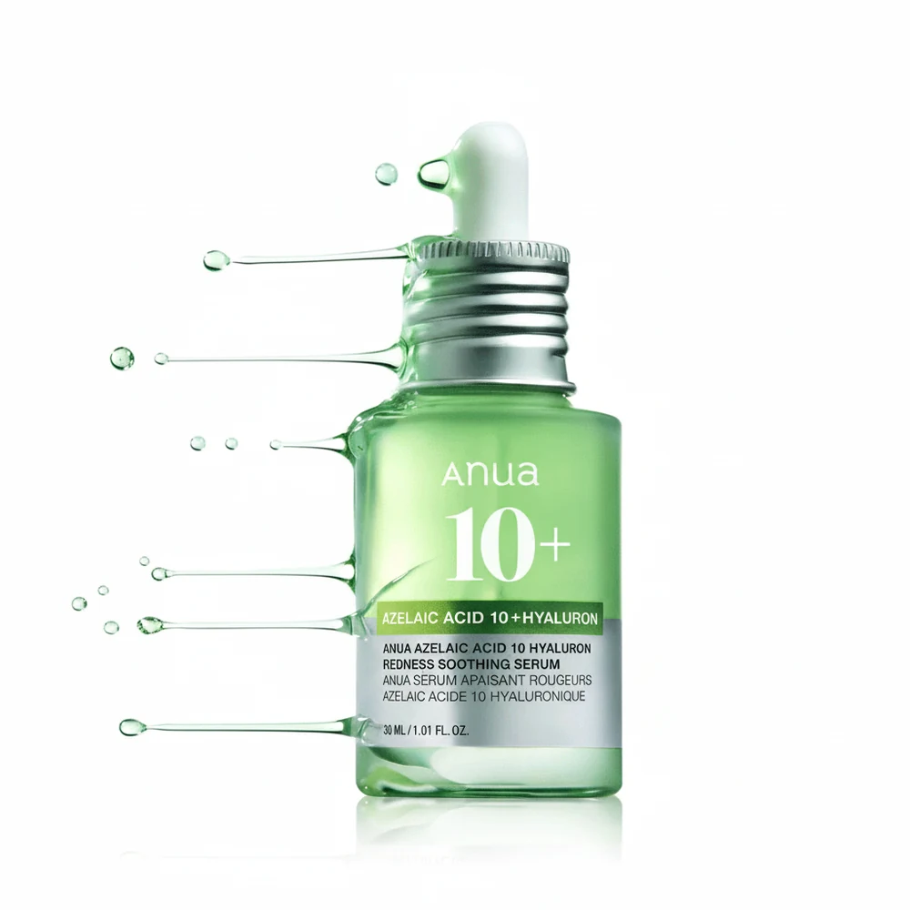 A clear glass bottle with a dropper lid, containing a light pink serum. The bottle has a white label with the Anua logo and product name.