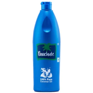 A clear glass bottle with a white label featuring the Parachut logo. The bottle contains a thick, opaque white coconut oil.