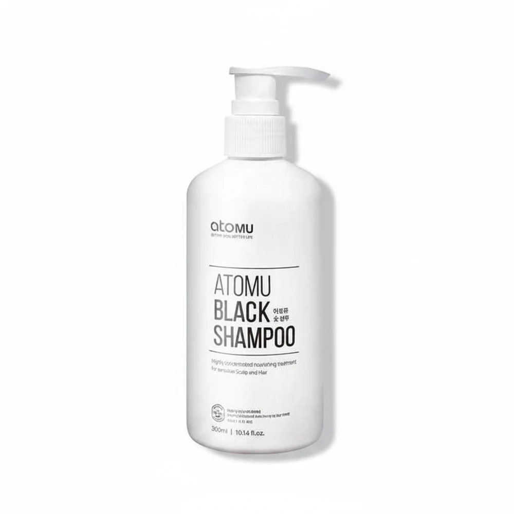 A black bottle of Atomou Black Shampoo with a label showing the brand name and product details.