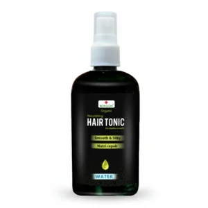 A 200ml bottle of Revel Hair Tonic with a white label and green accents. The bottle has a pump dispenser.