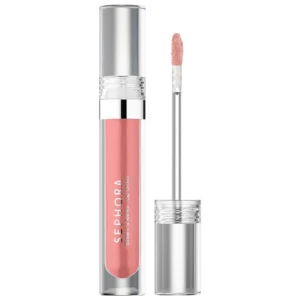 A clear, shiny lip gloss in a small, round plastic tube with the Sephora logo on the label