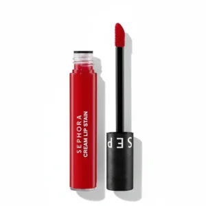 A red liquid lipstick in a clear plastic tube with the Sephora logo on the label