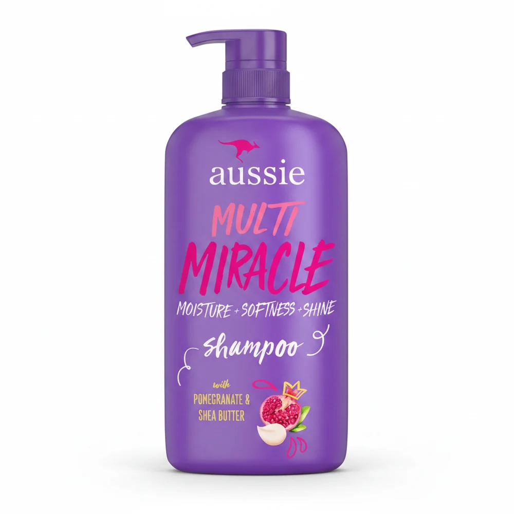 A 1L bottle of Aussie Multi Miracle Shampoo with a white label featuring the Aussie logo, 'Multi Miracle' text, and images of Shea Butter and Pomegranate.