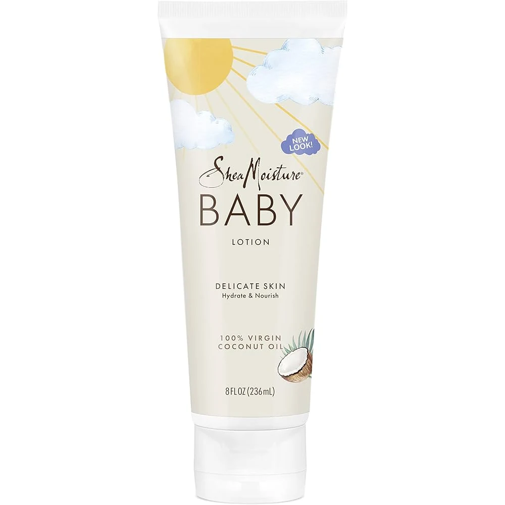 A white tube of SheaMoisture Baby Lotion with a green label featuring the SheaMoisture logo and images of coconut and murumuru butter.