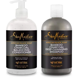 A 1L bottle of Shea Moisture Coconut & Hibiscus Shampoo and Conditioner. The bottle has a white label with the Shea Moisture logo and product name.
