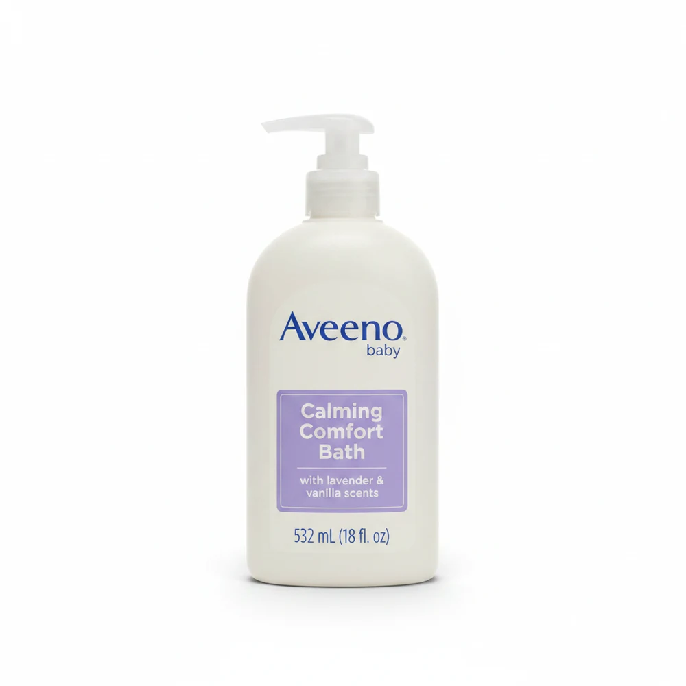 A 532 mL bottle of Aveeno Baby Calming Comfort Bath with a white label featuring the Aveeno logo, the product name, and images of lavender and vanilla.