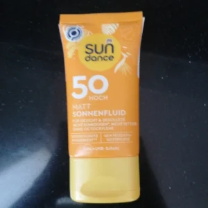 A bottle of Sun Dance Ultra Sensitive SPF 50+ Sunscreen Gel in a clear, cylindrical container with a white and blue label. The product has a lightweight, gel-like texture.