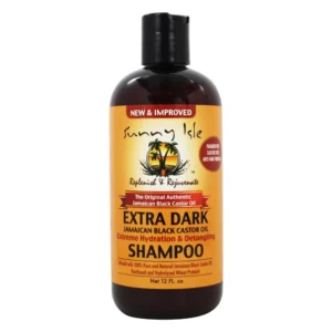 A bottle of Sunny Isle Extra Dark Jamaican Black Castor Oil Extreme Hydration & Detangling Shampoo and Conditioner in a dark amber color with a black label.