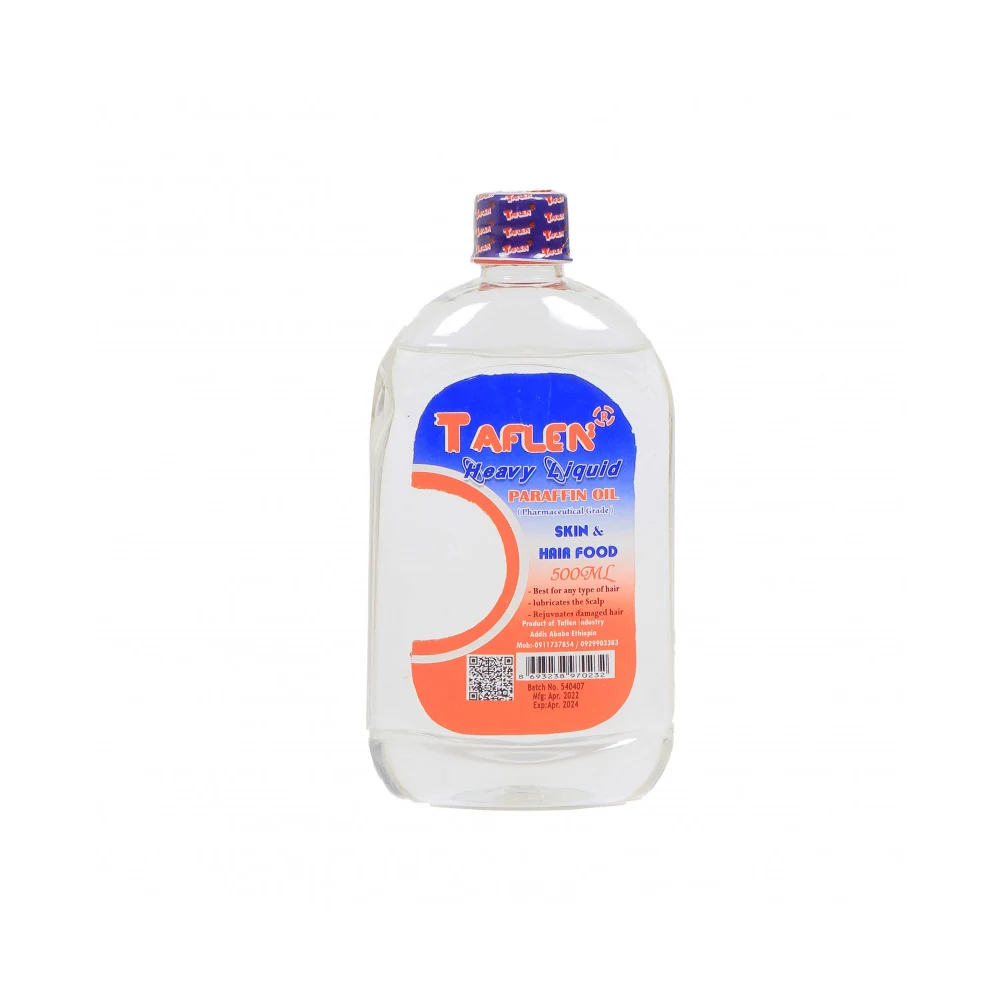 A clear glass bottle containing Taflen Heavy Liquid Paraffin Oil. The label shows the Taflen brand name and product details.