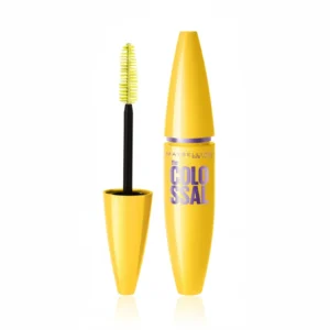 A black tube of MAYBELLINE The Colossal Volume Mascara with a black wand applicator. The label shows the product name and 'Glam Black' color.