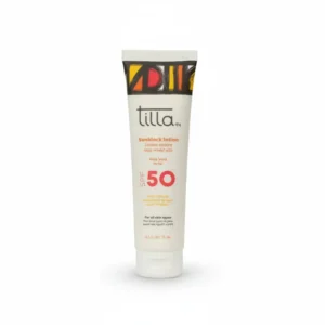 A white bottle with a blue and green label, containing Tilla sun screen SPF 50 sunscreen lotion