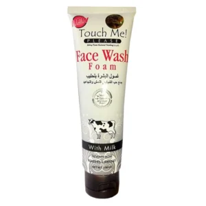 A white bottle with a light blue label that says 'Touch Me Foaming Cleanser' and shows a foaming, milky-white liquid inside.