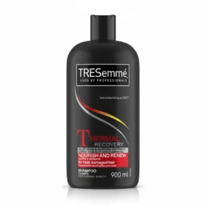 A bottle of Tresemme Rich Moisture Shampoo in a light blue color with the Tresemme logo and product name clearly visible on the label