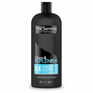 A bottle of TRESemme Clean And Replenish Conditioner with a green and white label. The bottle is 828ml in size.