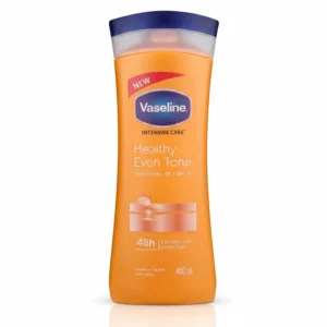 A white and blue bottle of Vaseline Healthy Even Tone UV Protection Body Lotion. The label features the Vaseline logo and indicates the product is 400ml in size.