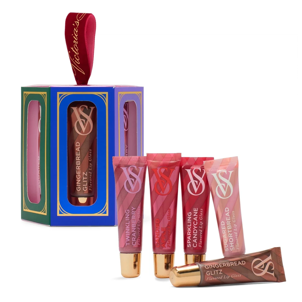 A tube of Victoria's Secret Lip Gloss in the Dubai flavor. The tube is pink with the Victoria's Secret logo and has a clear, shimmering gloss inside.