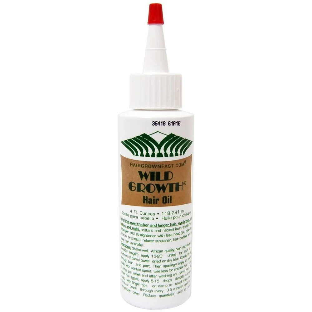 A bottle of Wild Growth Hair Oil with a label showing the product name and size (118 ml)