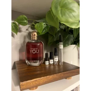 A glass bottle of Armani You Perfume for Men, featuring a black cap and the Armani logo on the label. The bottle has a rectangular shape with clean, modern lines.