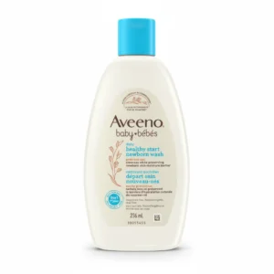 A white bottle with the Aveeno Baby logo and label. The bottle contains a creamy, oatmeal-infused baby wash.