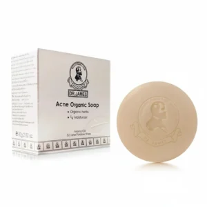 A rectangular bar of Dr. James Acne Organic Soap with a green and white label. The soap is a light beige color.
