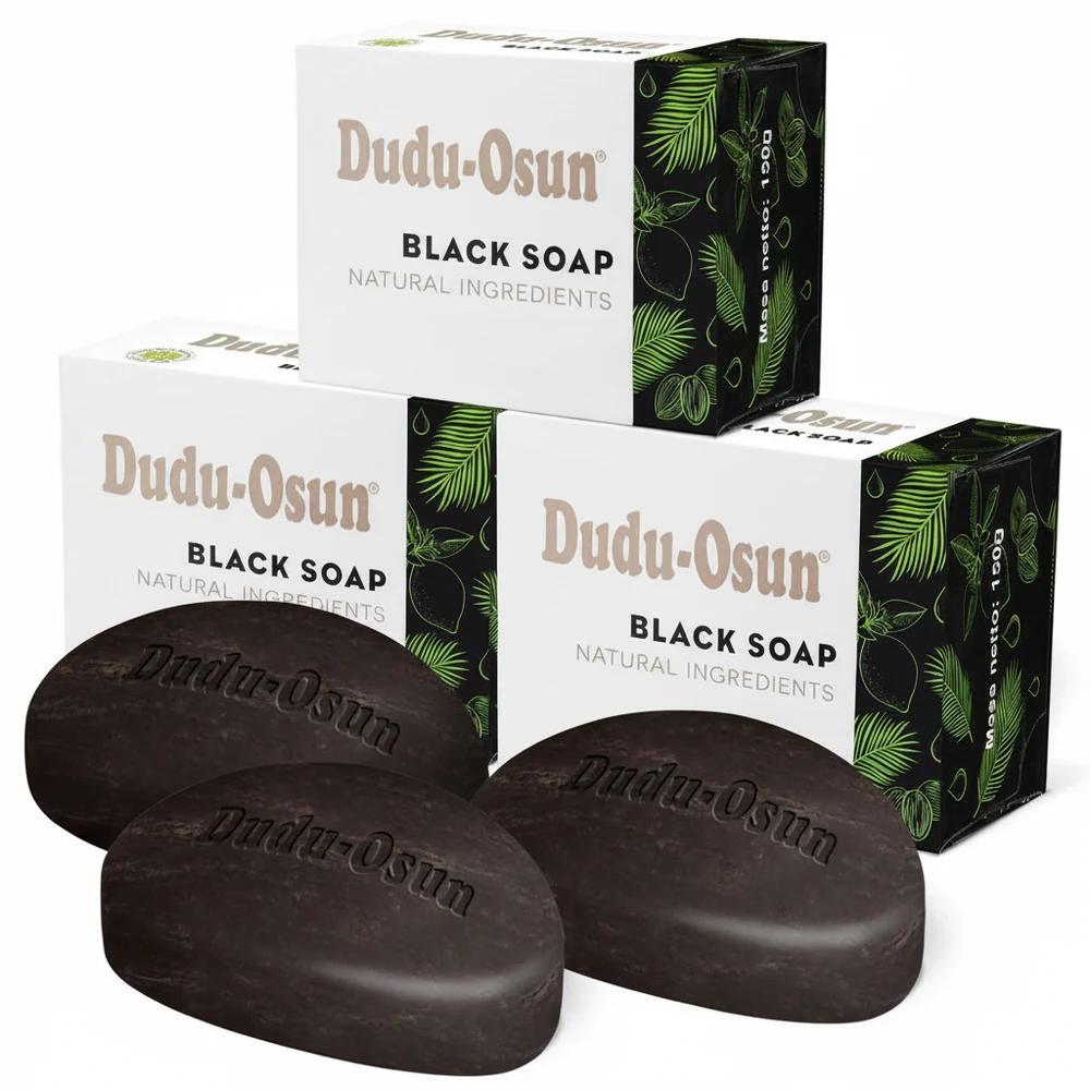 A round black bar of Dudu Osun African Black Soap with a green leaf design on the label