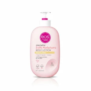 A bottle of EOS Shea Better Body Lotion in a light green color with a white label. The label features the EOS logo and the product name 'Crème de Pistachio'.