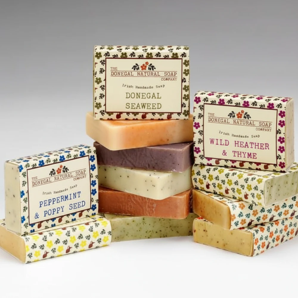 A rectangular bar of natural, handmade soap with a dark charcoal color and white label