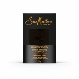 A rectangular bar of Shea Moisture soap with a light brown color and the brand name printed on the label