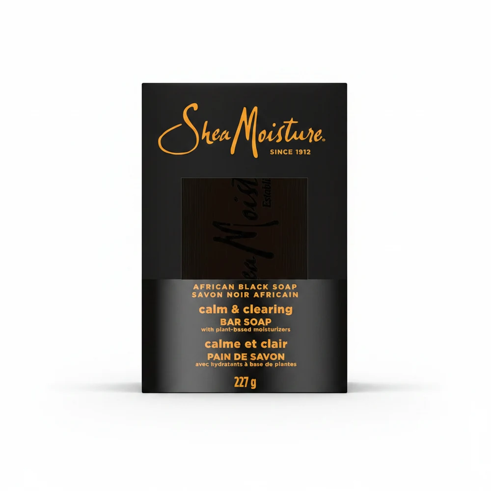 A rectangular bar of Shea Moisture soap with a light brown color and the brand name printed on the label